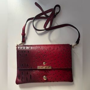 Red ostrich leather crossbody bag with gold accents